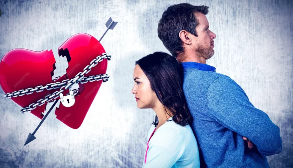 anzeichen für eine kaputte beziehung  Ein Paar steht Rücken an Rücken, symbolisch für emotionale Distanz.